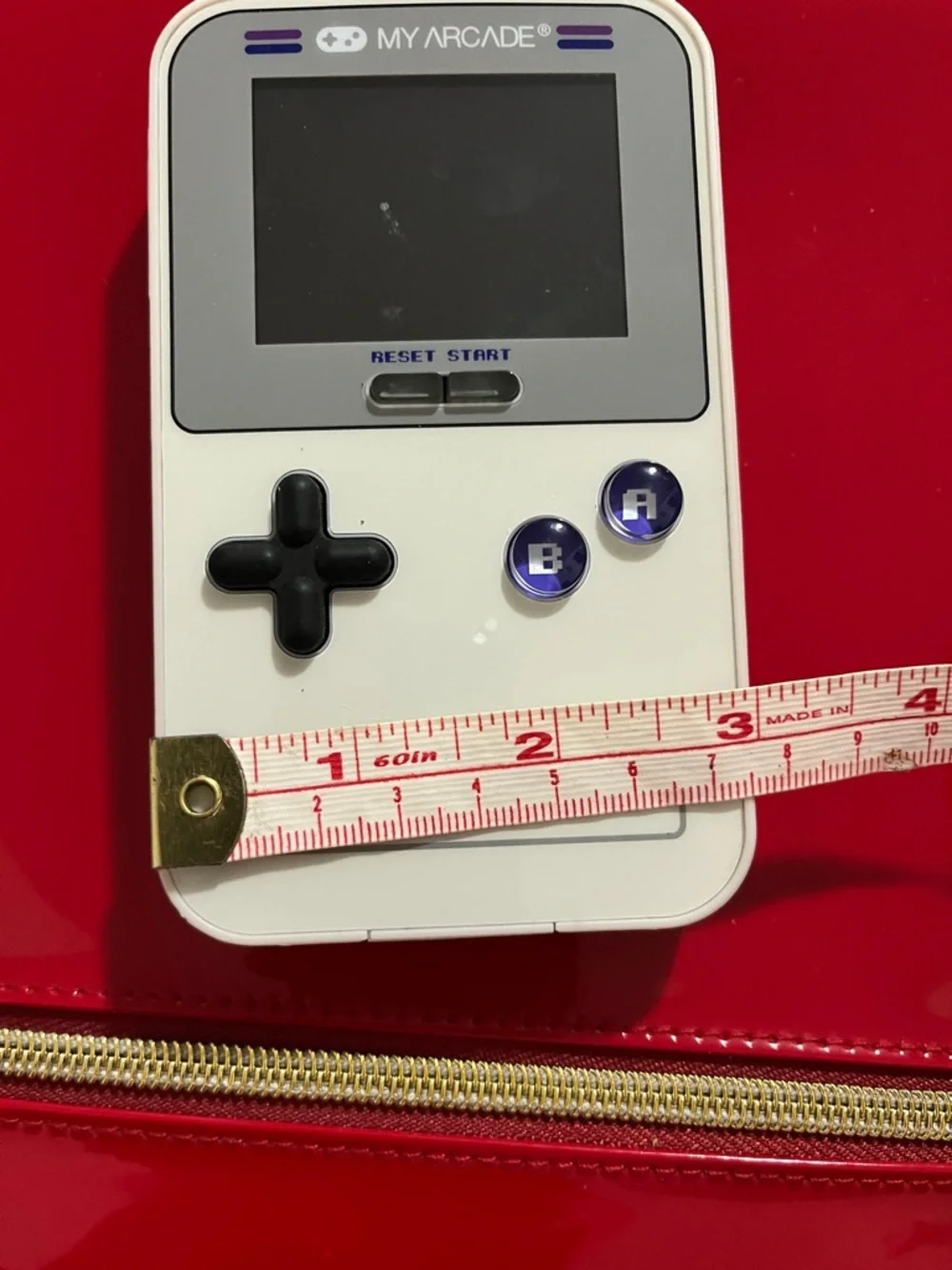 Arcade GO GAMER White Handheld Console with Black D-pad and Purple Buttons